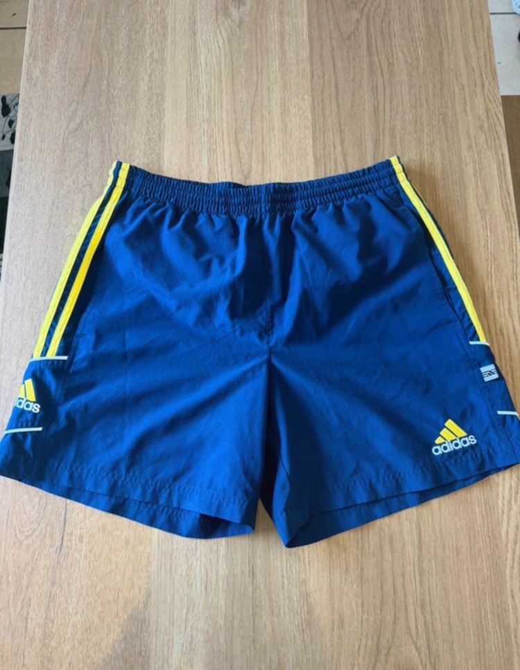 Immagine di Adidas Blue Shorts With Yellow Stripes 1