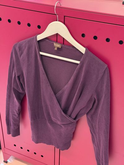 Purple wrap style knit top