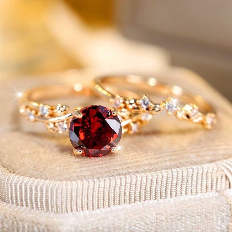 Gold Ring With Red Gemstone And Small Clear Stones