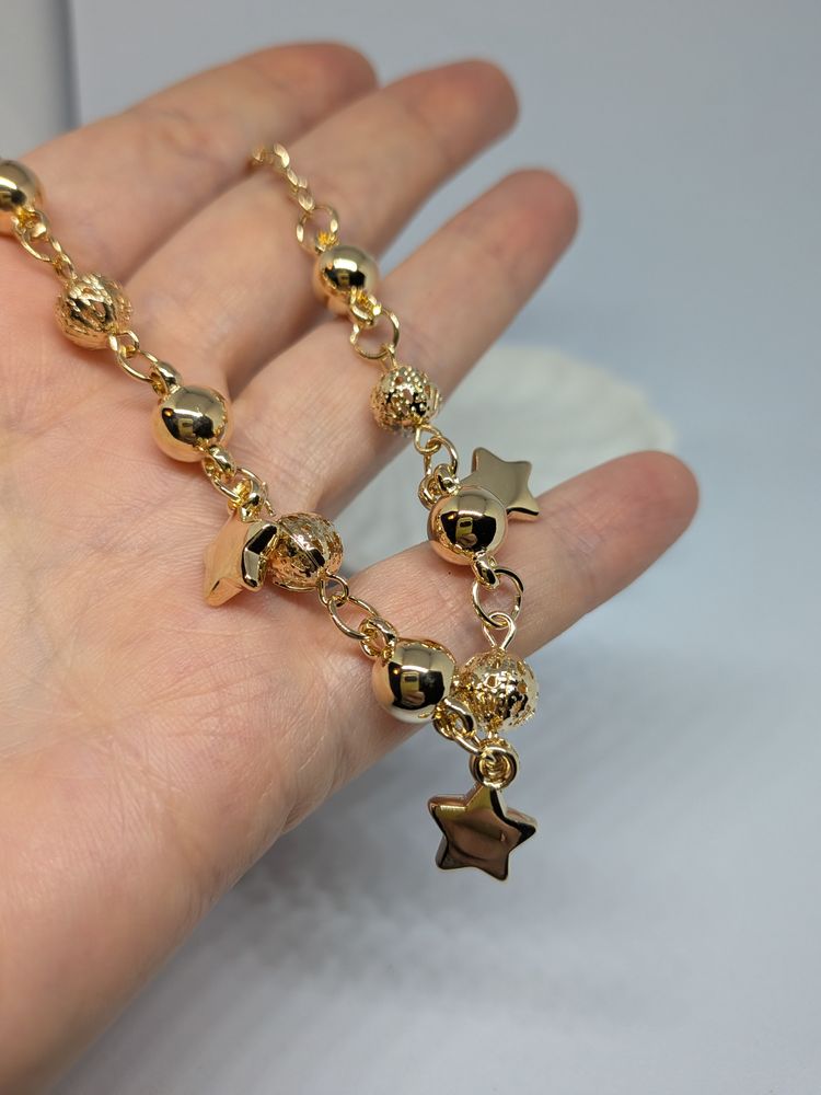 Gold-Tone Bracelet With Star Charms