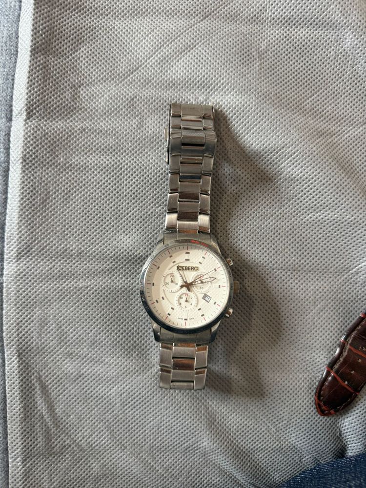 silver wristwatch with metal band