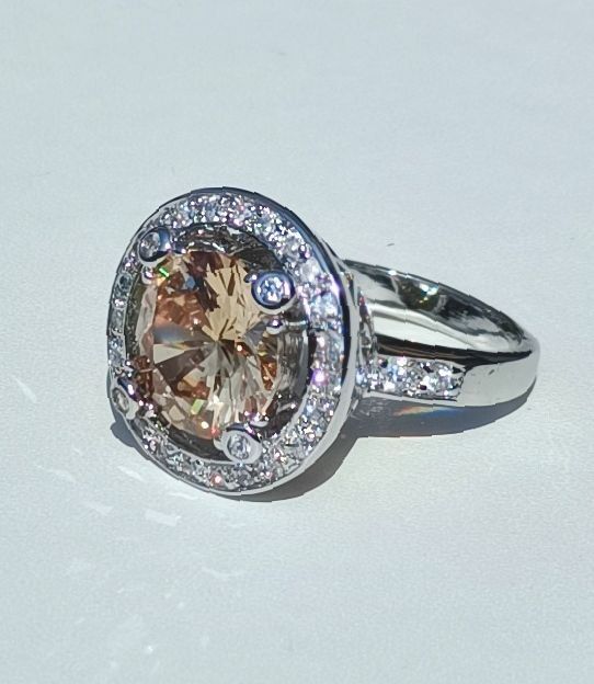 Bella Gone Silver Ring With Large Peach Gemstone And Small Clear Stones product image