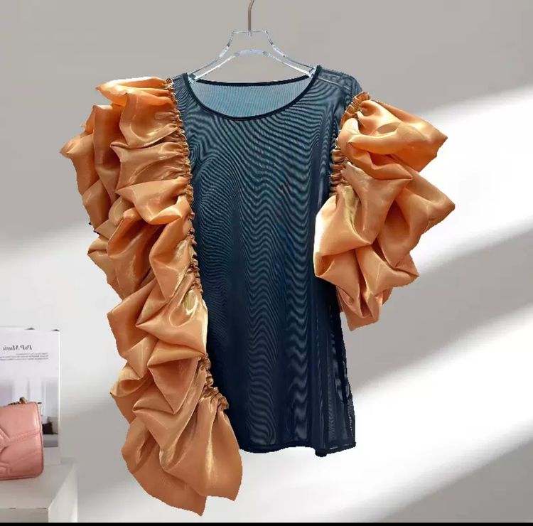 Black Top With Large Orange Ruffled Sleeves