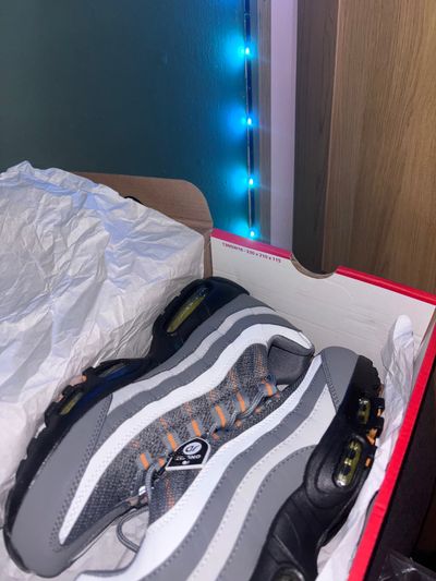 grey and orange sundial Nike 95s