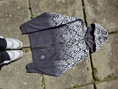 Black And White Zip-Up Hoodie With Graphic Text Pattern