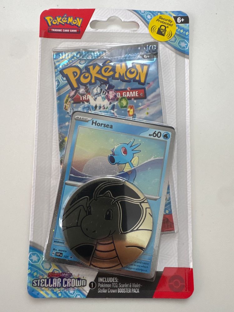 Pokémon Trading Card Game Stellar Crown Booster Pack With Dragonite Coin And Horsea Card