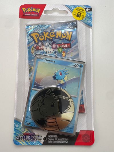 Pokémon Trading Card Game Stellar Crown Booster Pack With Dragonite Coin And Horsea Card