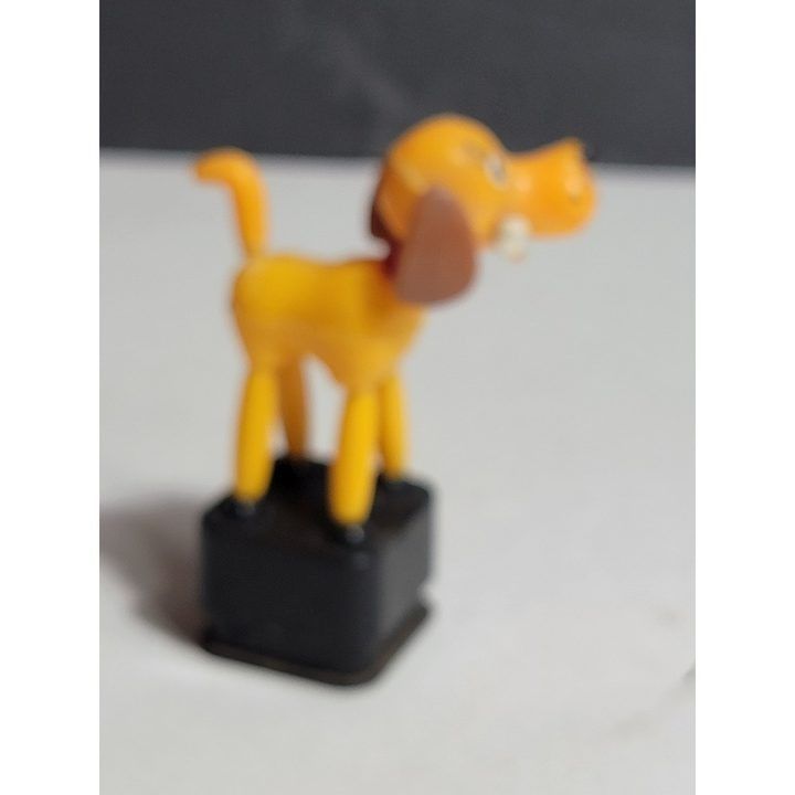 Yellow Dog Figurine On Black Base image 3