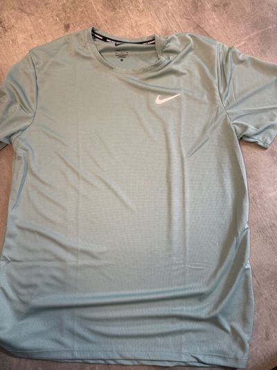 Nike jade green dri fit miler