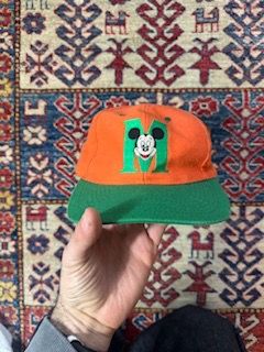 Orange And Green Cap With Cartoon Character