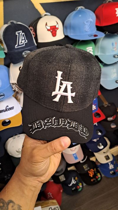 Black And Gray Cap With La Logo And Dazed Text