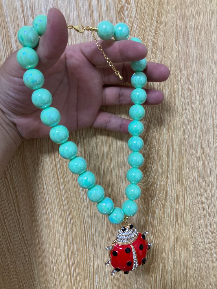 Anthropologie Turquoise Bead Necklace With Ladybug Pendant product image