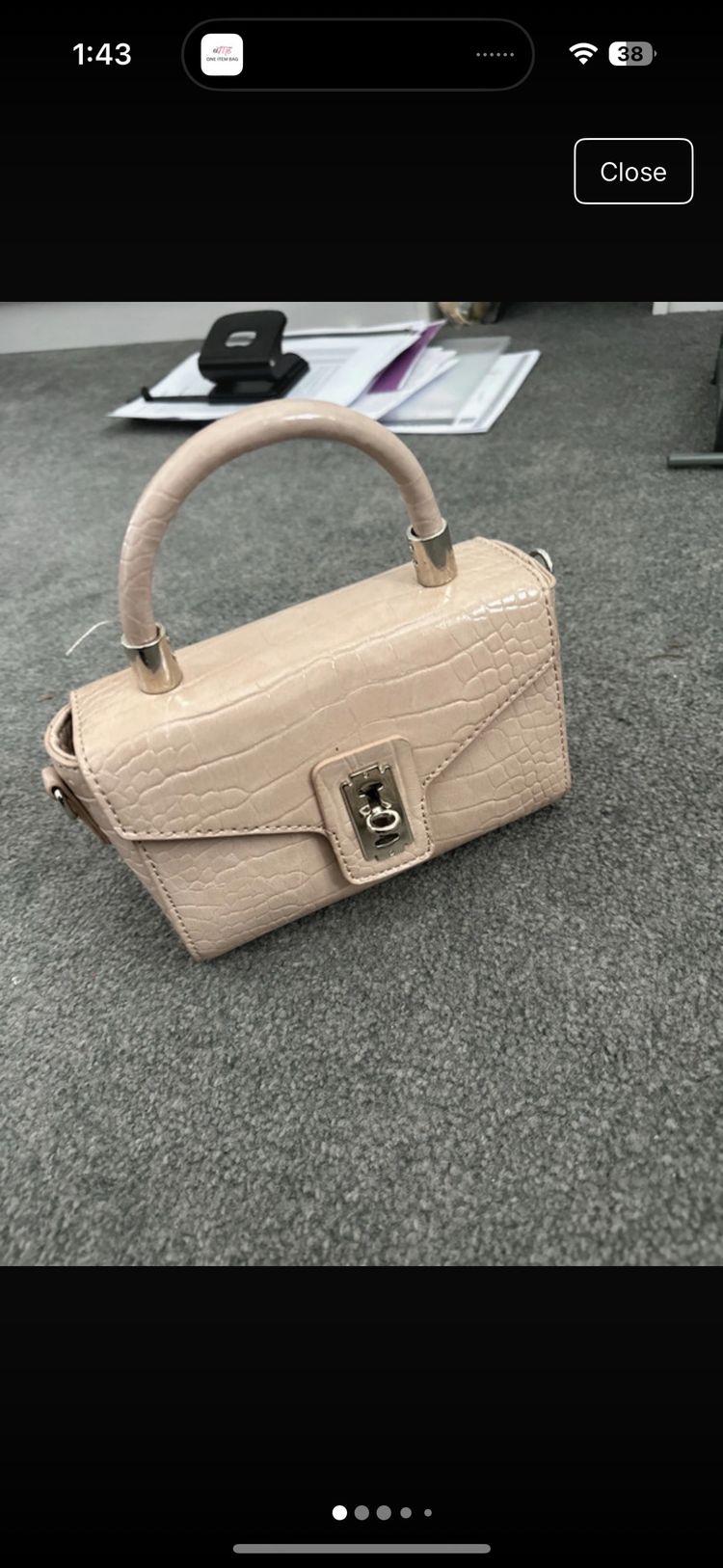 beige handbag with croc texture and top handle