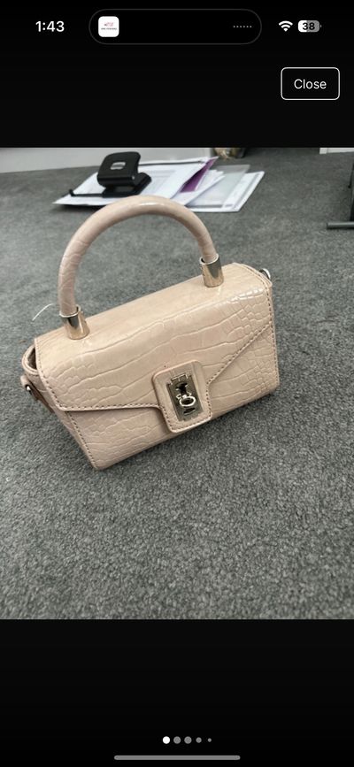 beige handbag with croc texture and top handle